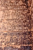 Prasat Kravan - bas reliefs on the brickwork, rows of standing figures in prayer.